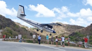 A Winair DHC-6-300 Twin Otter makes its usual approach into St. Barths. Courtesy Alain Duzant